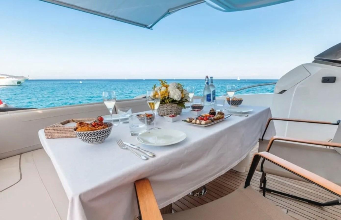 a table set for a meal on a boat aboard PRINCESS S72 Yacht for Sale