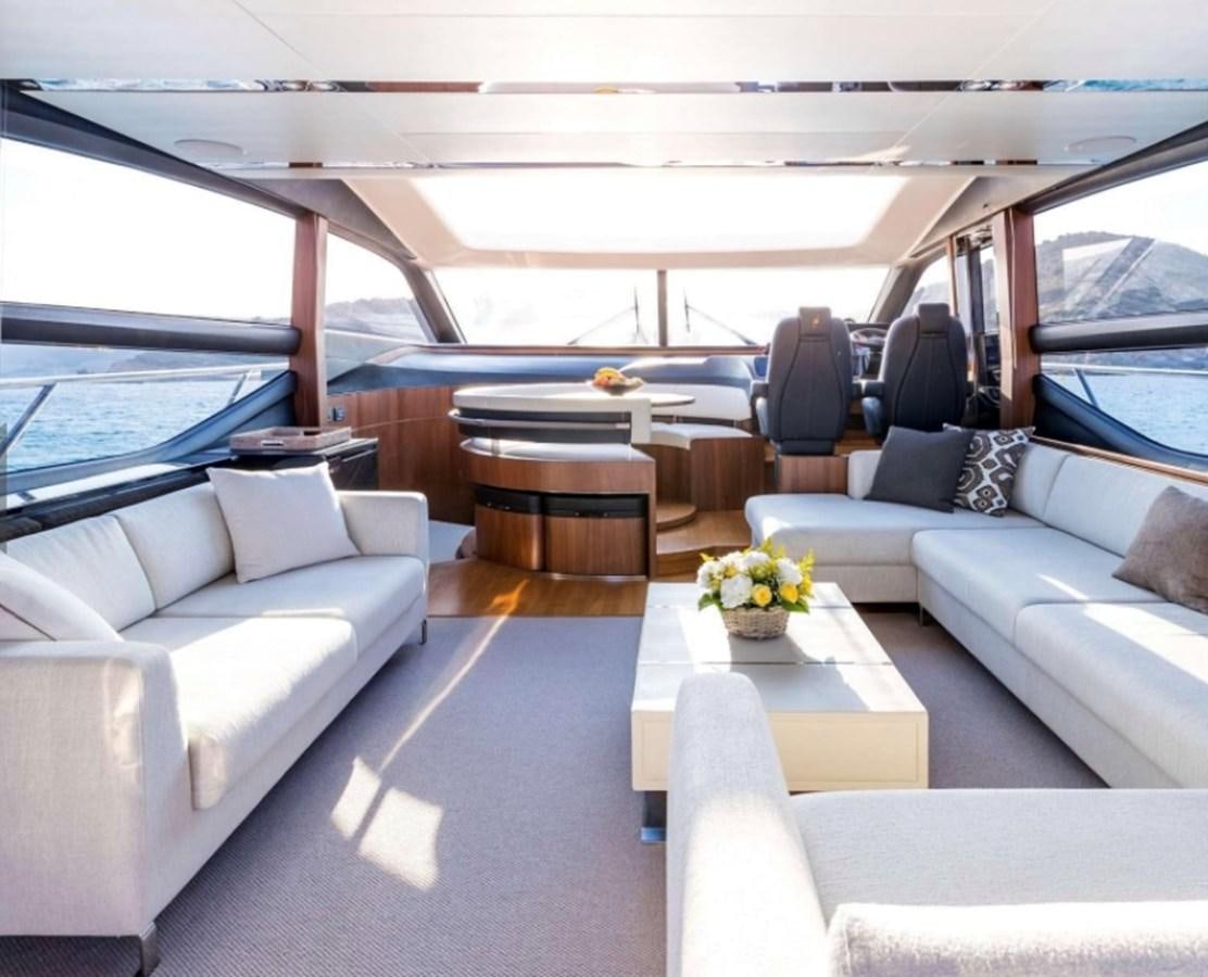 a boat with a table and chairs aboard PRINCESS S72 Yacht for Sale