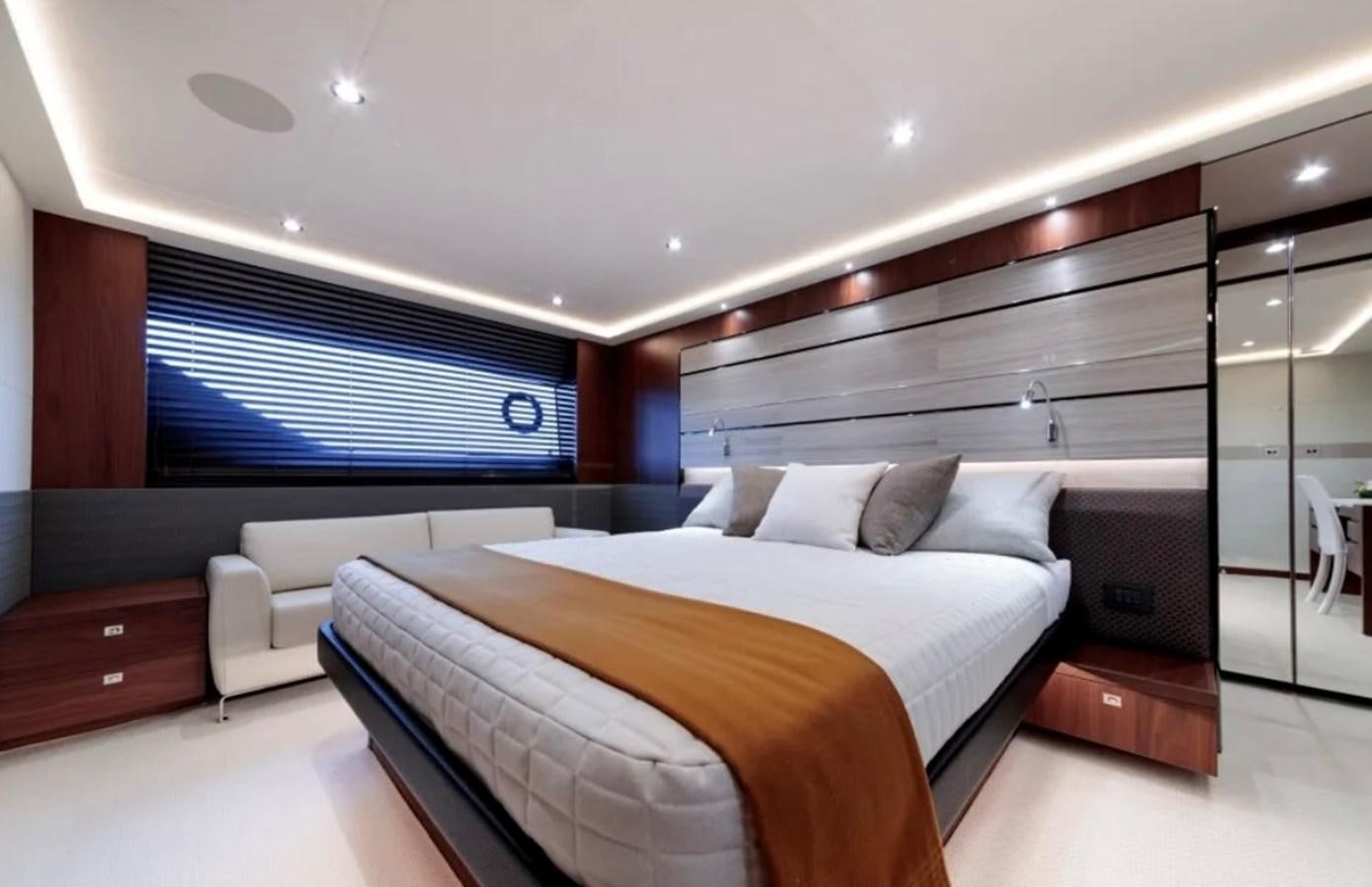 a room with a bed and a couch aboard PRINCESS S72 Yacht for Sale