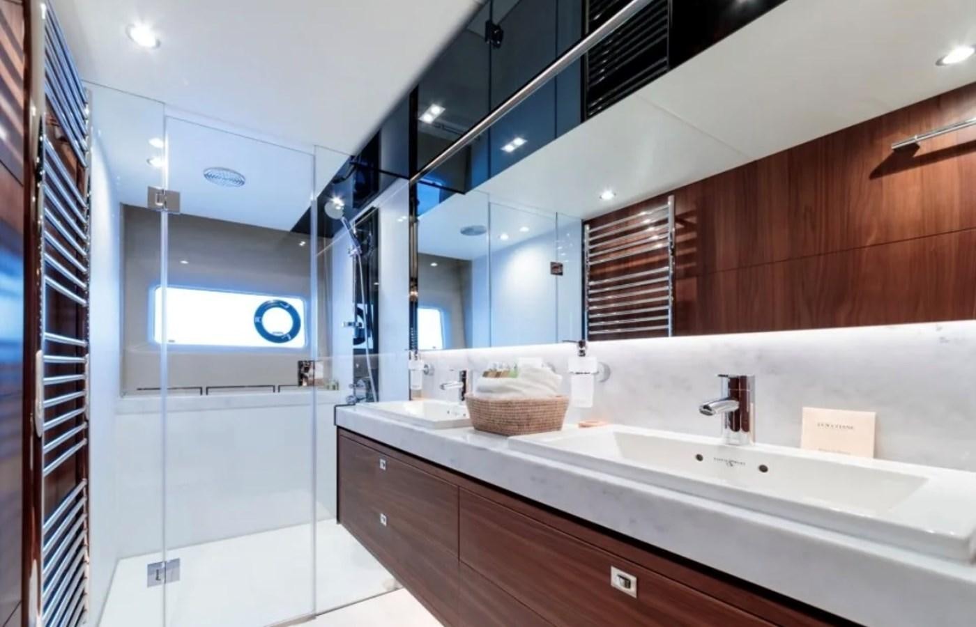 a bathroom with a large mirror aboard PRINCESS S72 Yacht for Sale