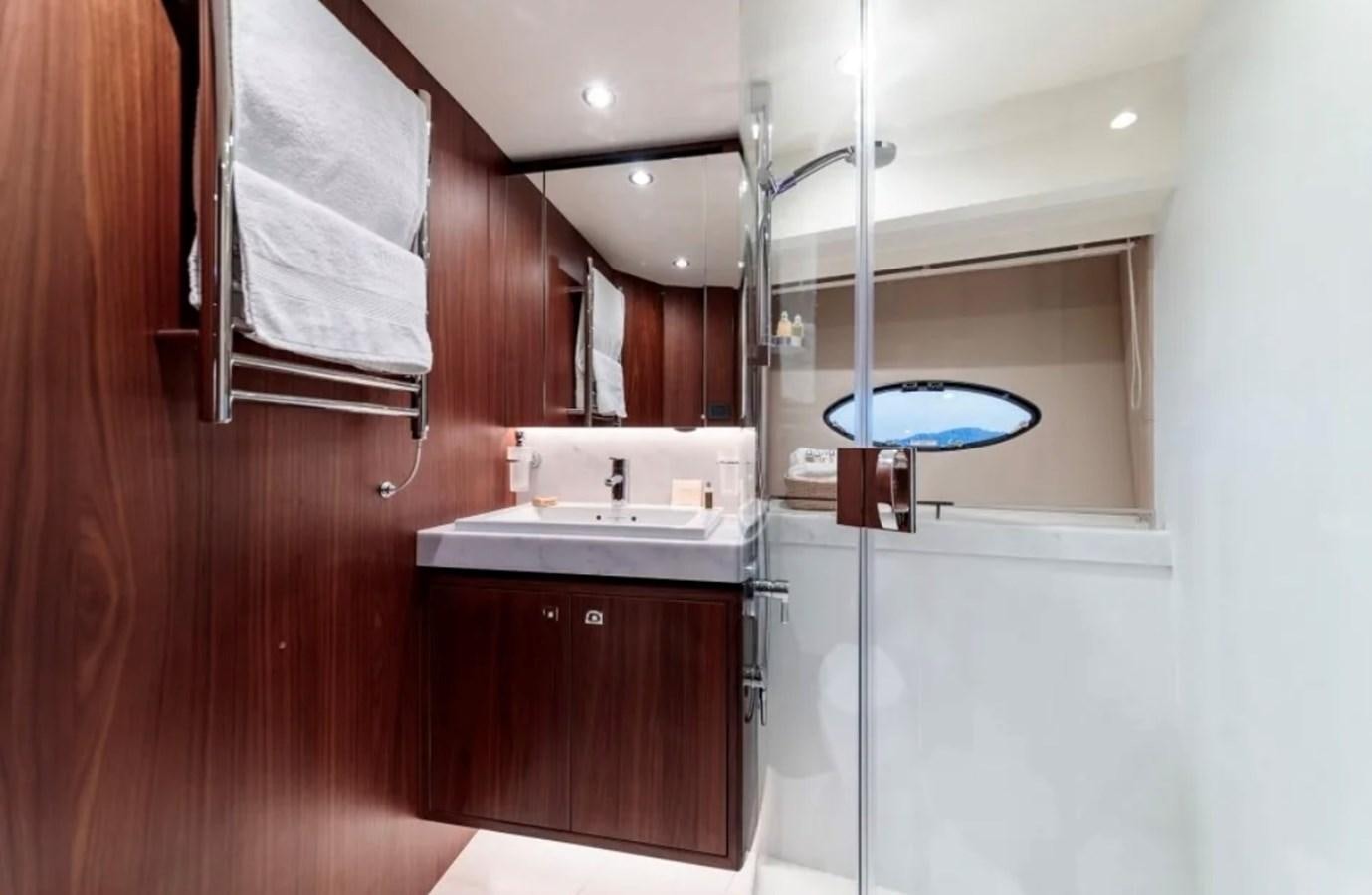 a bathroom with a sink and a mirror aboard PRINCESS S72 Yacht for Sale