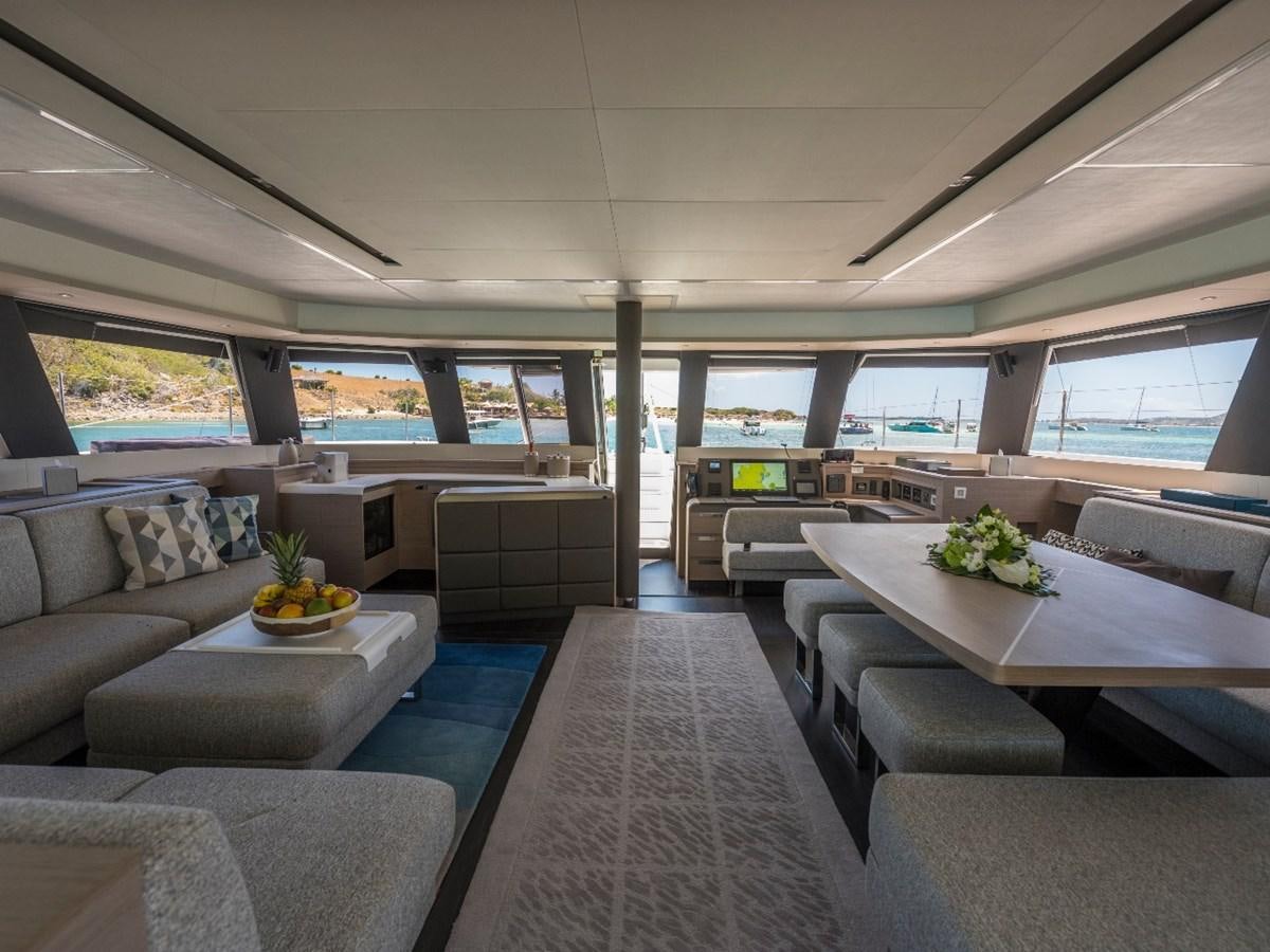 a room with couches and a table aboard LISA OF THE SEAS Yacht for Sale