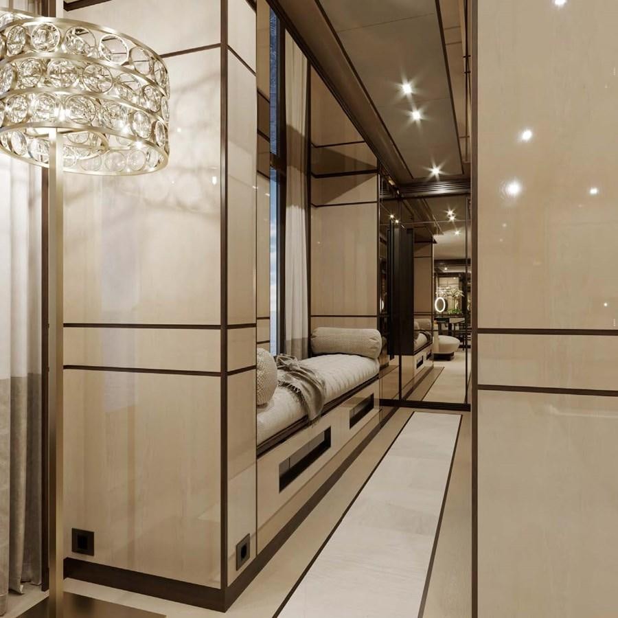 a large room with a bed and a chandelier aboard RELIANCE Yacht for Sale