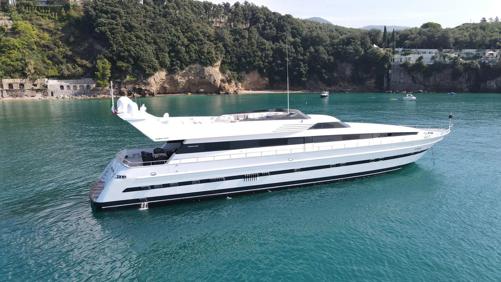 a white boat in the water aboard IXIA Yacht for Sale