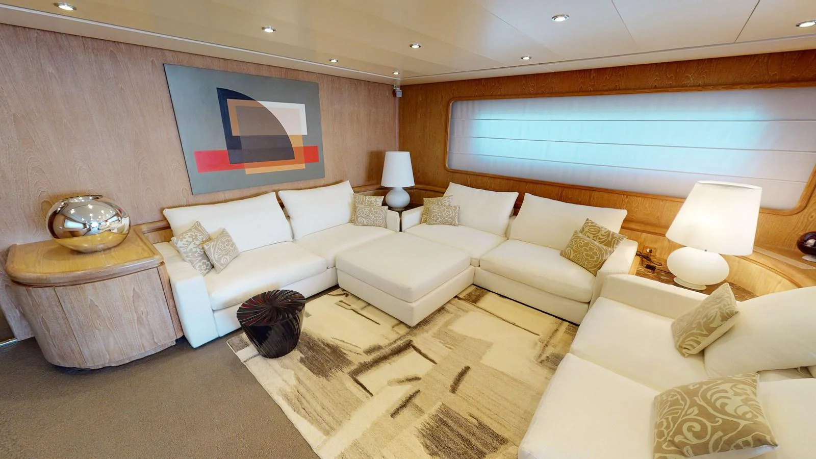 a living room with a large window aboard IXIA Yacht for Sale