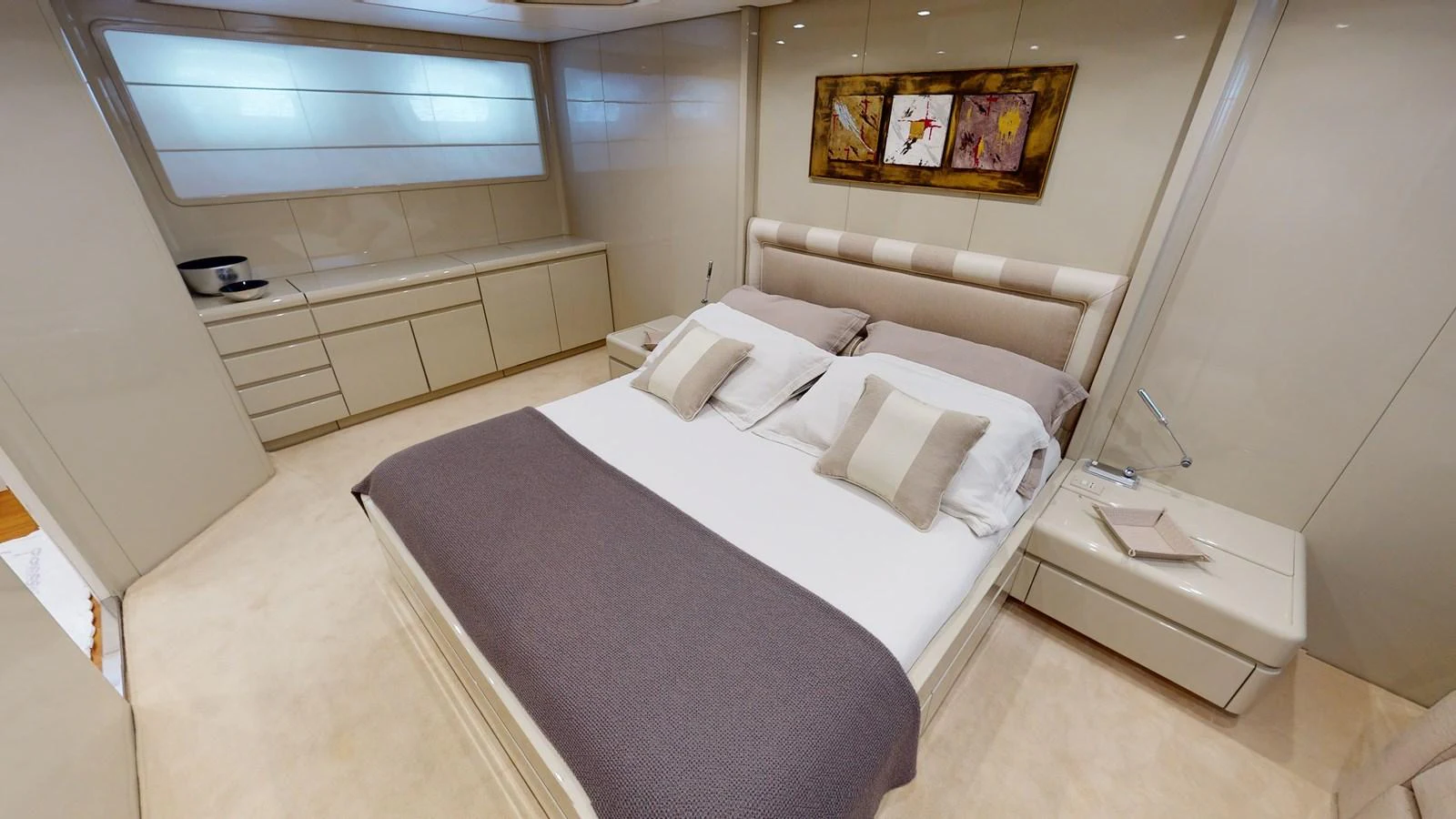 a room with a bed and a desk aboard IXIA Yacht for Sale