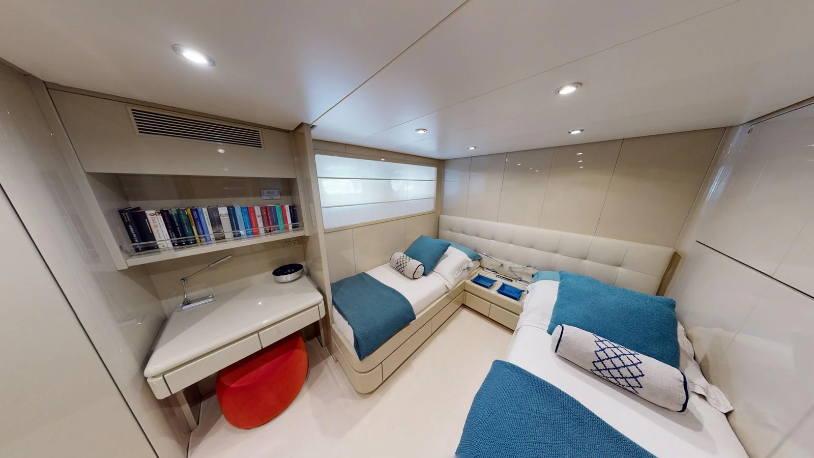 a room with a bed and a desk aboard IXIA Yacht for Sale