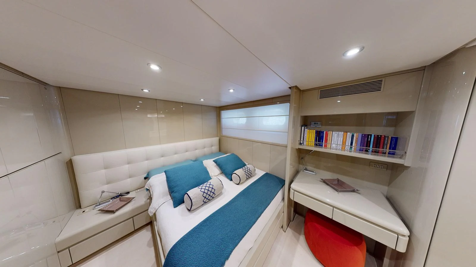 a room with a bed and a desk aboard IXIA Yacht for Sale