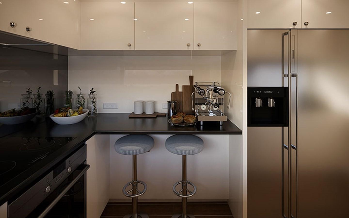 a kitchen with a stainless steel refrigerator aboard AF Yacht for Sale