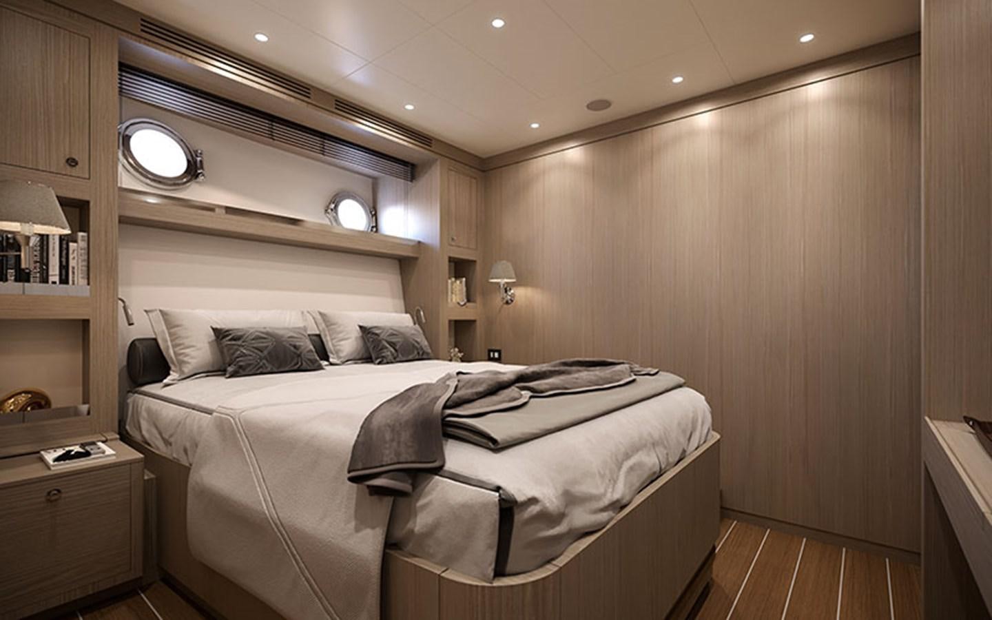 a bedroom with a bed and a desk aboard AF Yacht for Sale