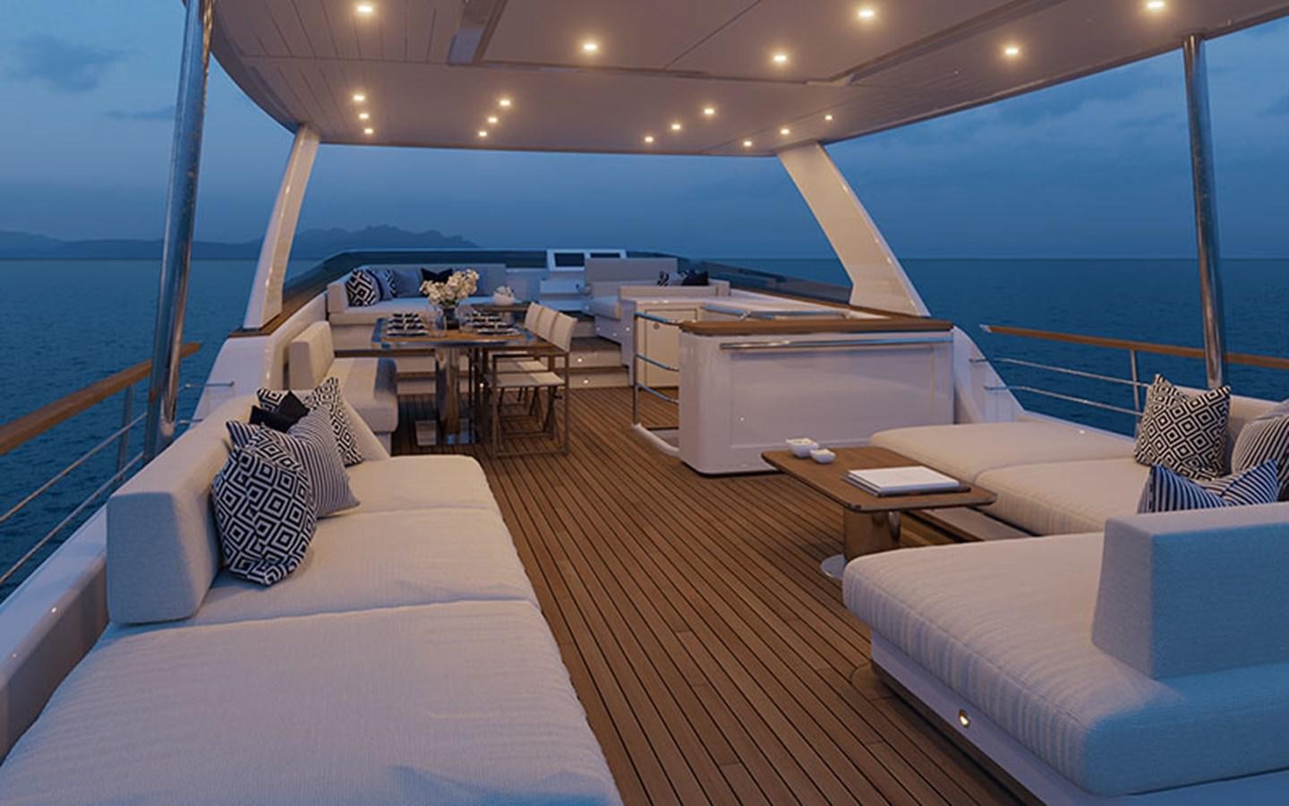 a room with a bed and a table and a couch aboard AF Yacht for Sale