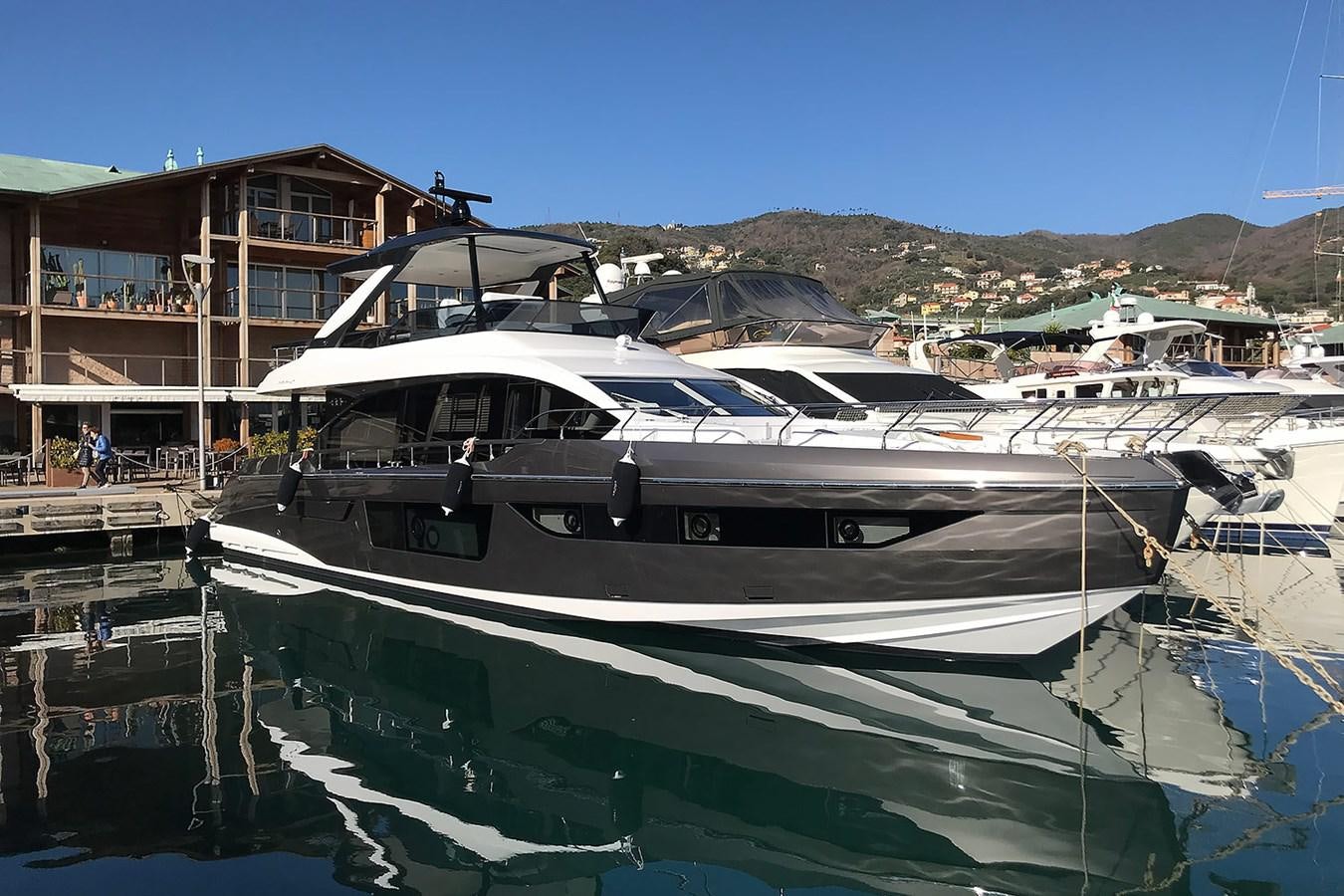 a boat docked at a pier aboard SUNSTROKE Yacht for Sale