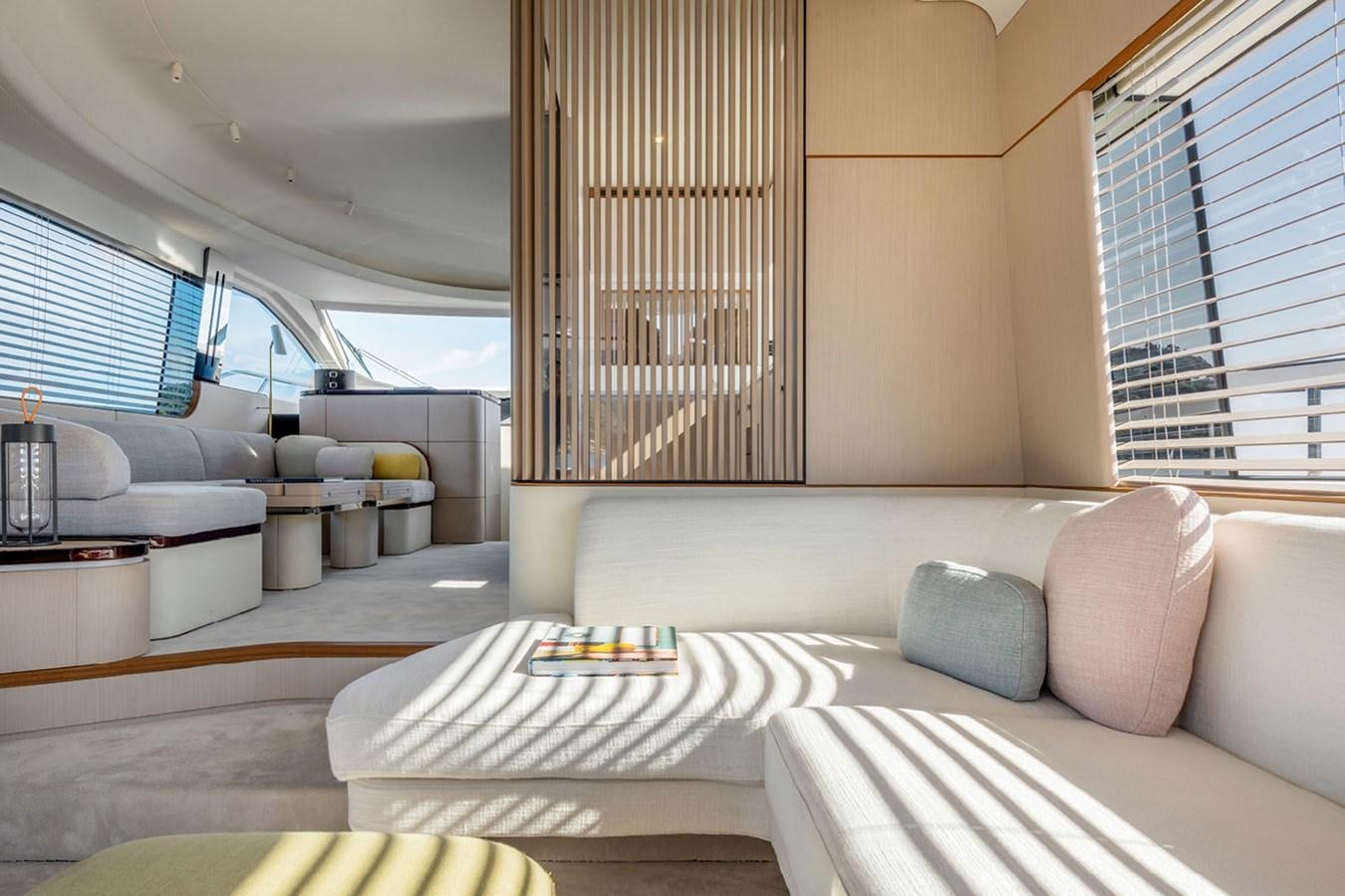 a living room with a large window aboard SUNSTROKE Yacht for Sale