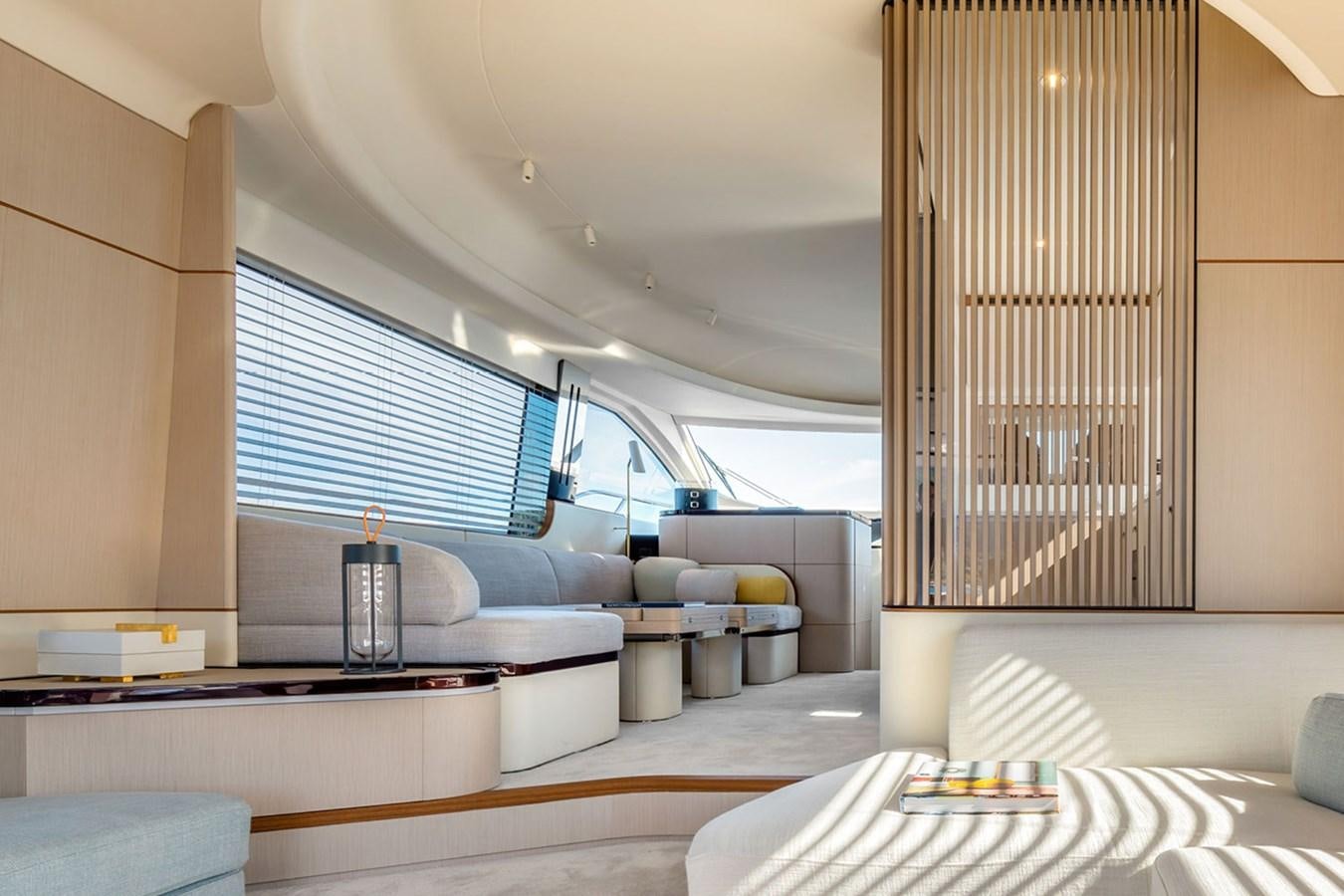 a room with a large window and a table with chairs and a large window aboard SUNSTROKE Yacht for Sale