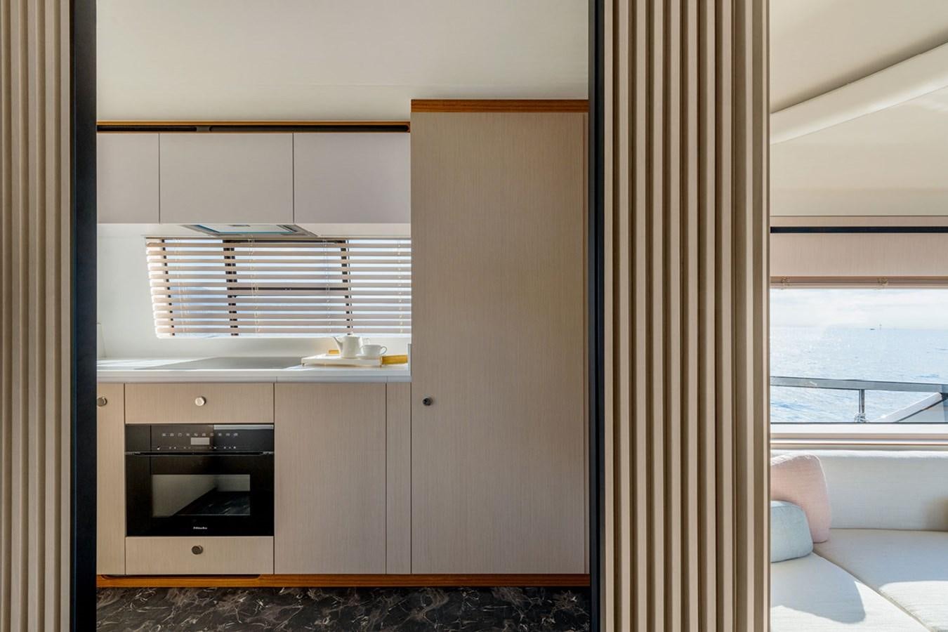 a room with a closet and a bed aboard SUNSTROKE Yacht for Sale
