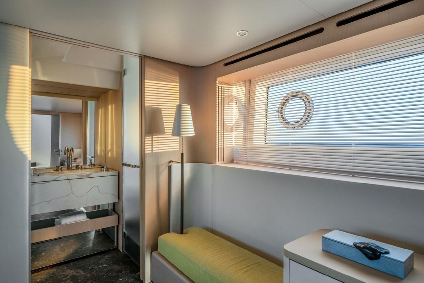 a room with a bed and a desk aboard SUNSTROKE Yacht for Sale