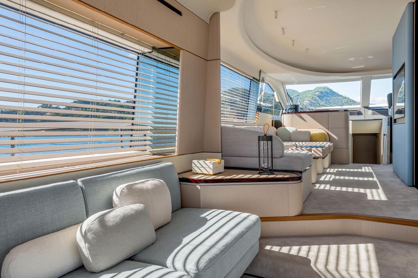 a living room with a large window aboard SUNSTROKE Yacht for Sale