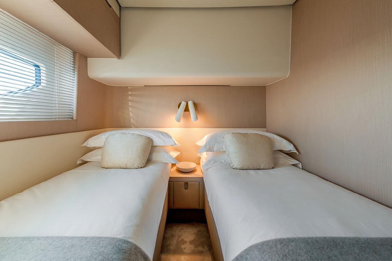 two beds in a room aboard SUNSTROKE Yacht for Sale