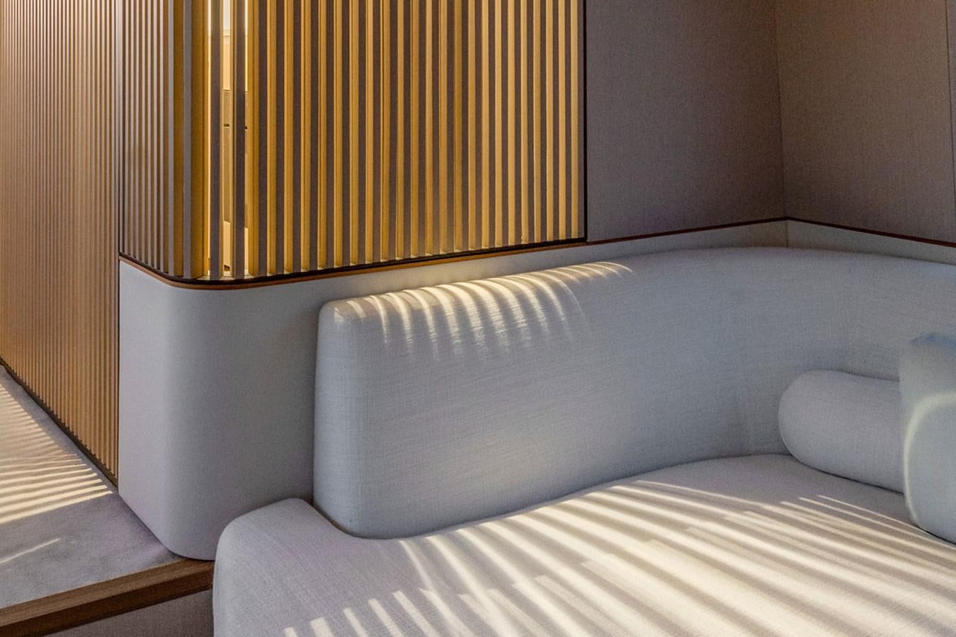 a bed with a white sheet aboard SUNSTROKE Yacht for Sale