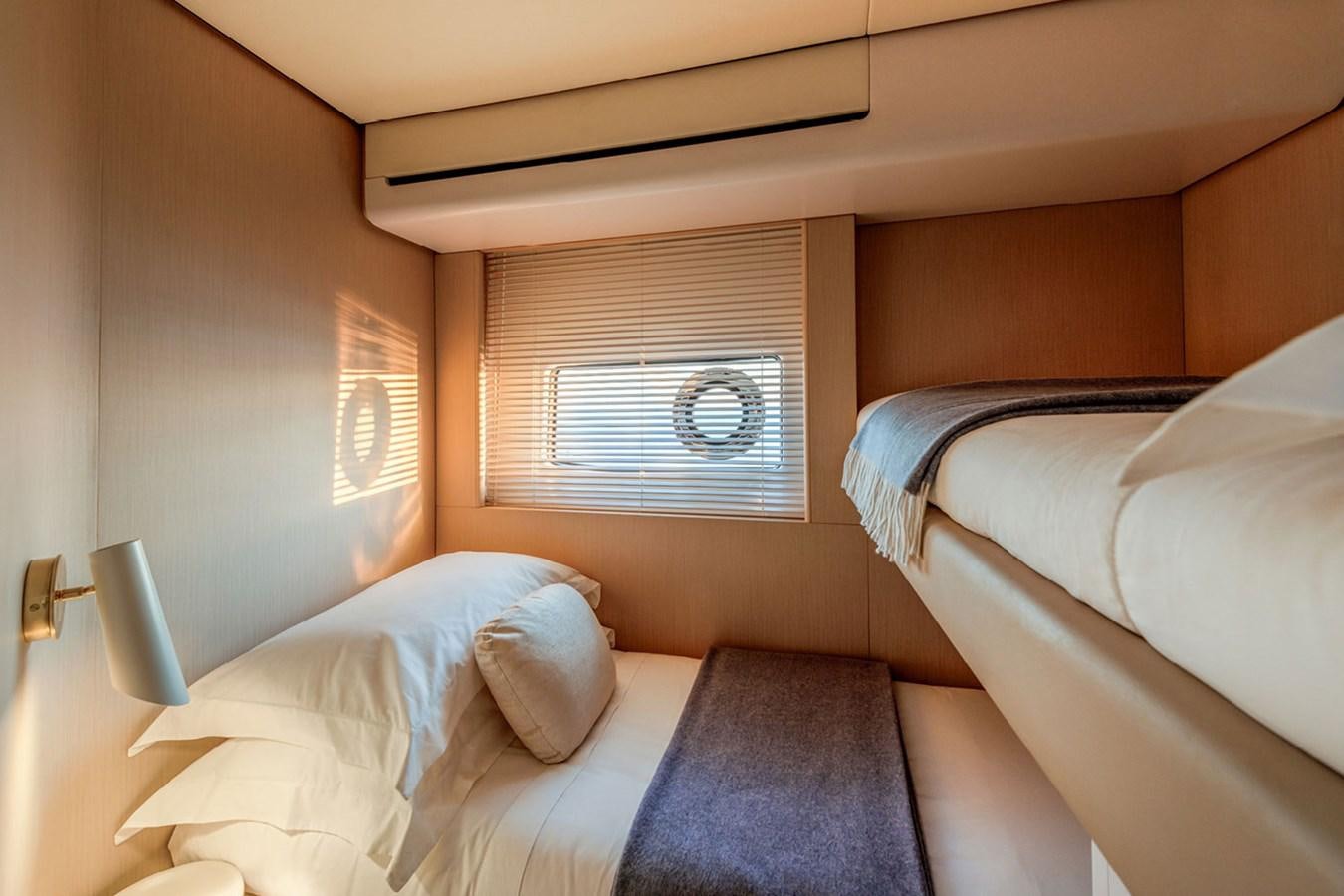 a room with two beds aboard SUNSTROKE Yacht for Sale
