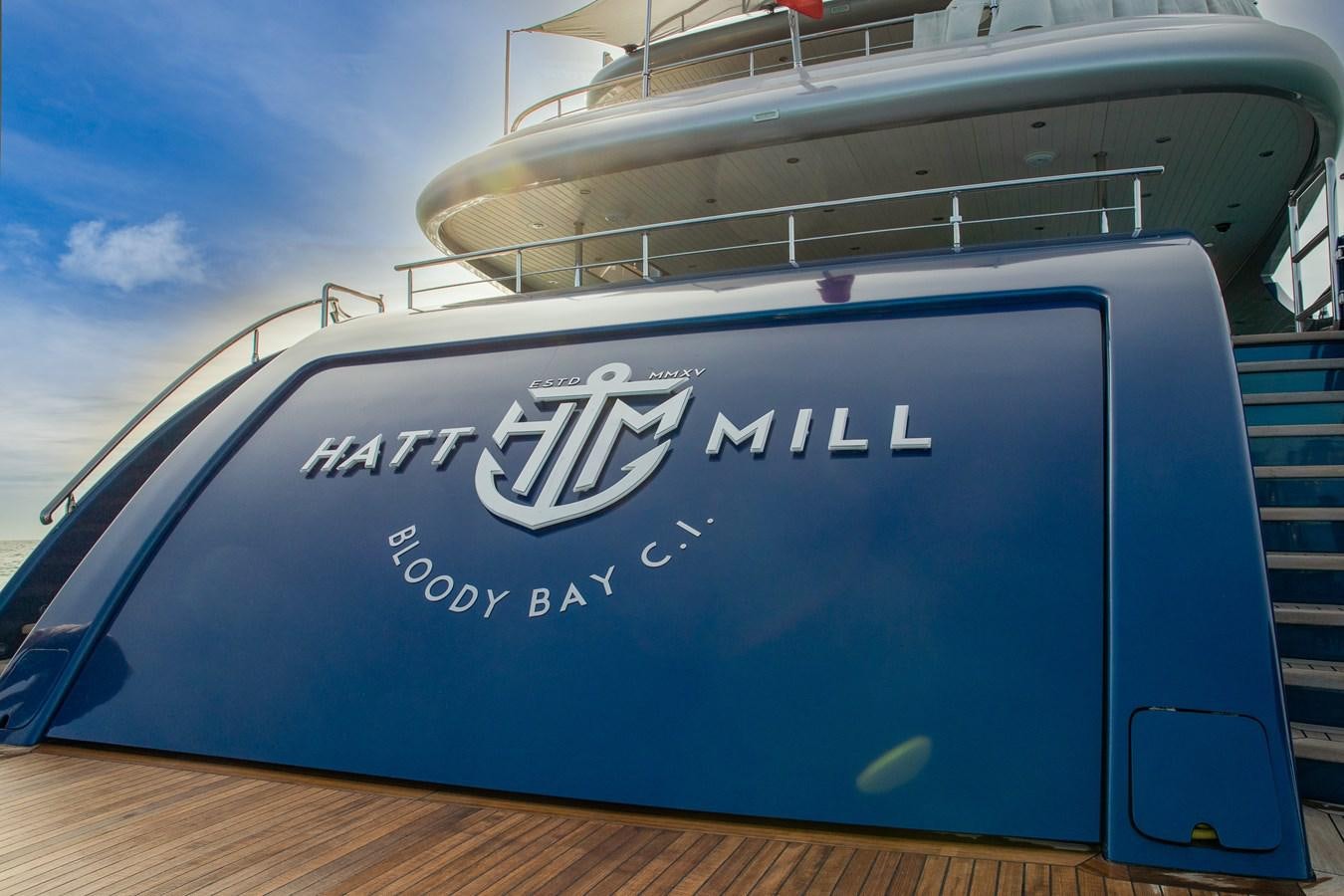 a blue boat on a dock aboard HATT MILL Yacht for Sale