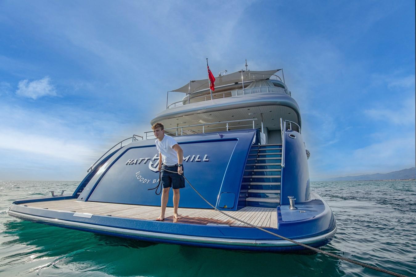 a person standing on a boat aboard HATT MILL Yacht for Charter