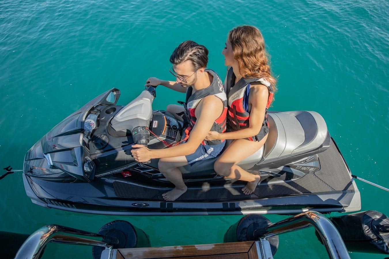 a couple of kids in a go kart aboard HATT MILL Yacht for Sale