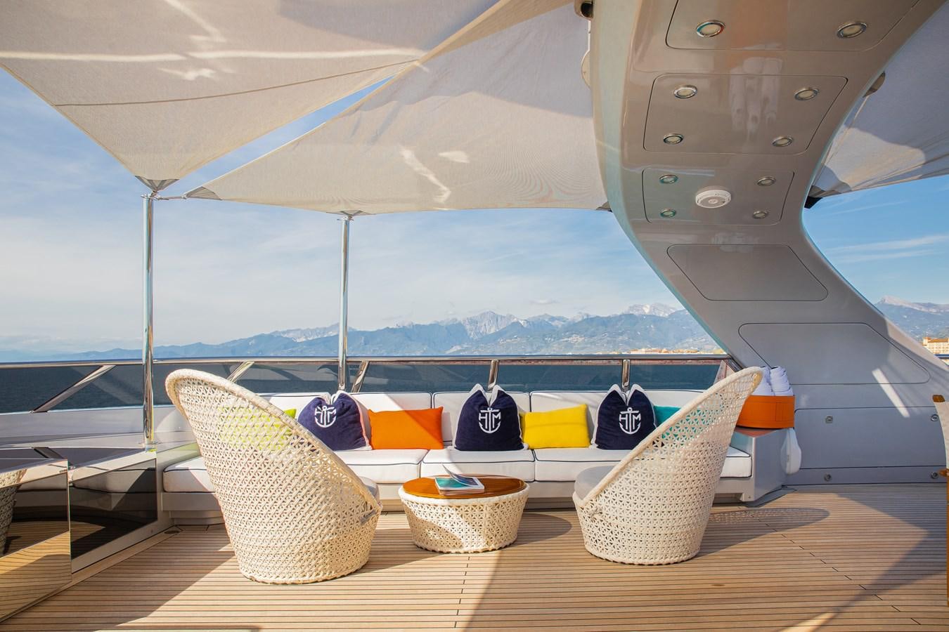 a hammock with pillows and pillows on a deck aboard HATT MILL Yacht for Charter