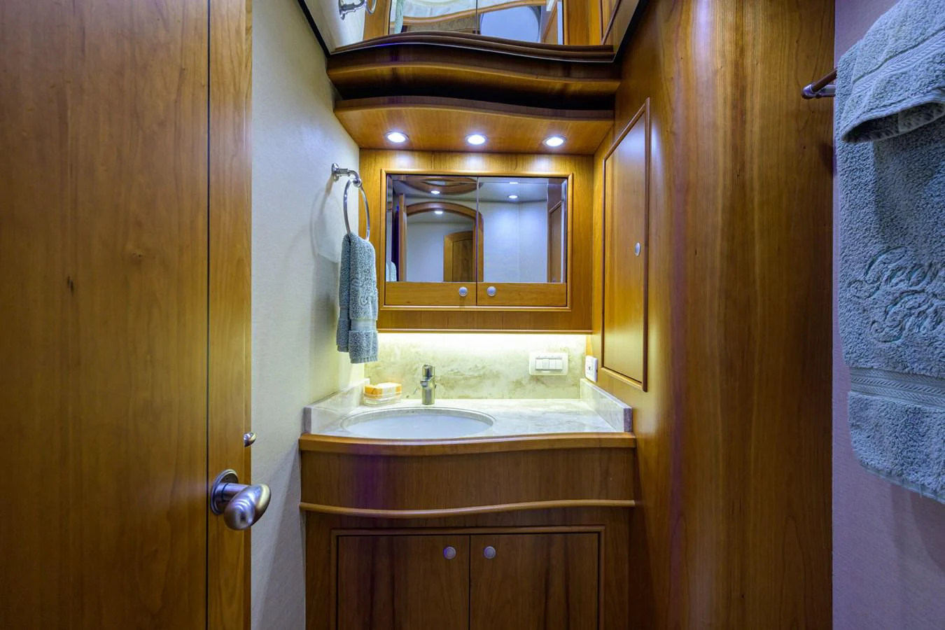 a bathroom with a sink and a mirror aboard GEORGIA GIRL Yacht for Sale