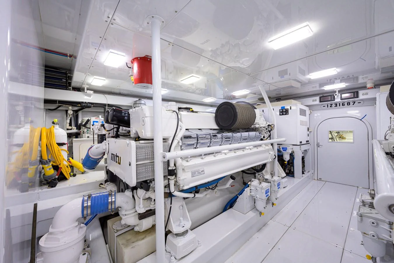 a room with white pipes and equipment aboard GEORGIA GIRL Yacht for Sale