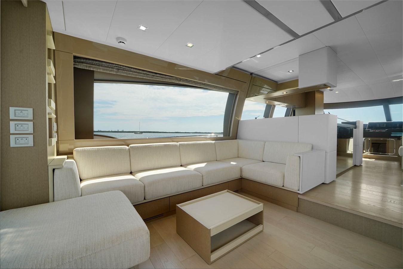 a room with a couch and a table aboard G3 Yacht for Sale