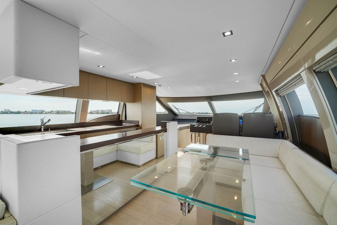 a room with a couch and a table aboard G3 Yacht for Sale