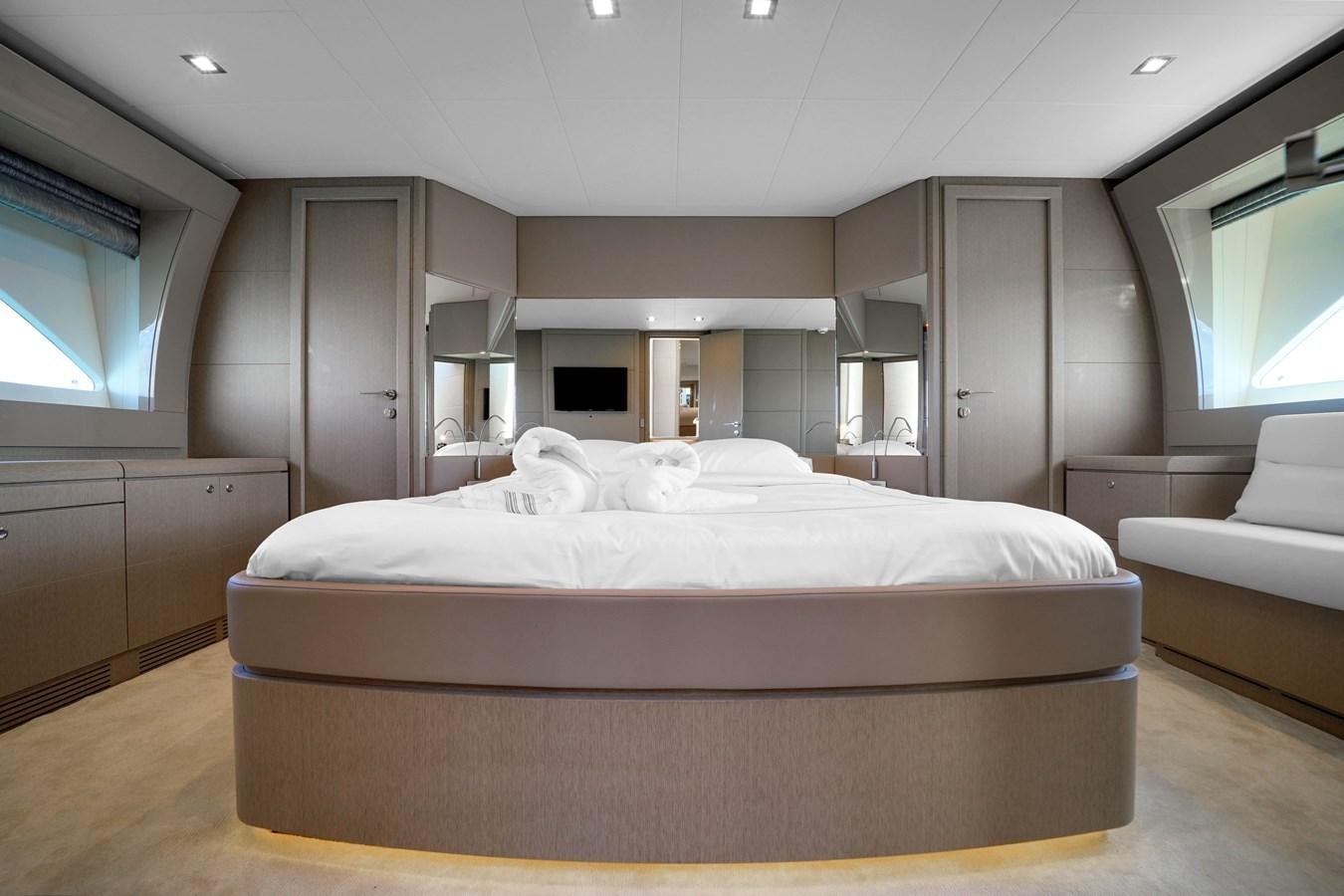a room with a bed and a couch aboard G3 Yacht for Sale