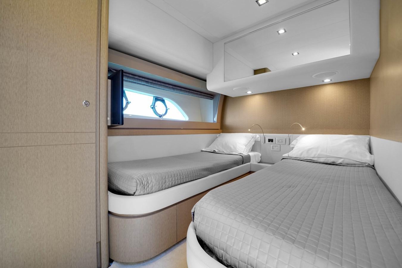 a room with two beds aboard G3 Yacht for Sale