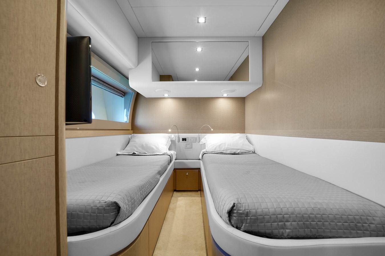 a room with two beds aboard G3 Yacht for Sale