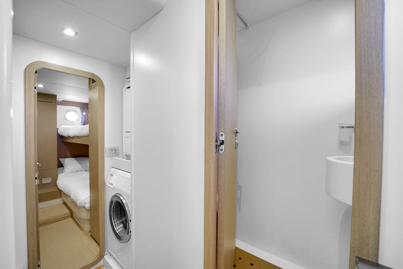 a bathroom with a closet and a bed aboard G3 Yacht for Sale
