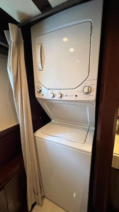 a washing machine in a room aboard BT-2 Yacht for Sale
