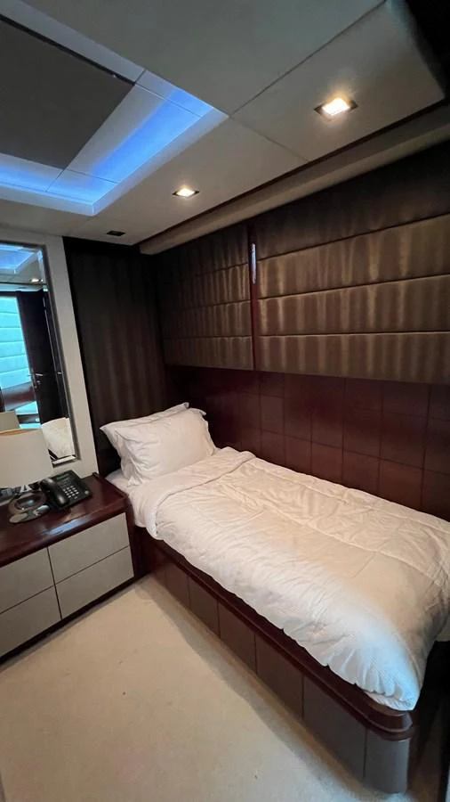 a bed with a white sheet aboard BT-2 Yacht for Sale