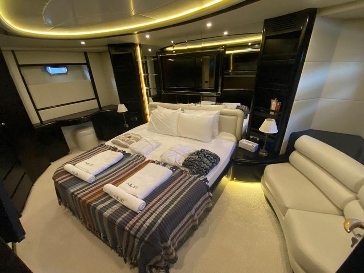 a hotel room with a bed and a tv aboard NILE Yacht for Sale