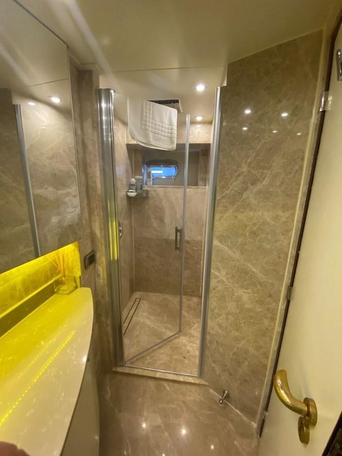 a bathroom with a glass shower aboard NILE Yacht for Sale