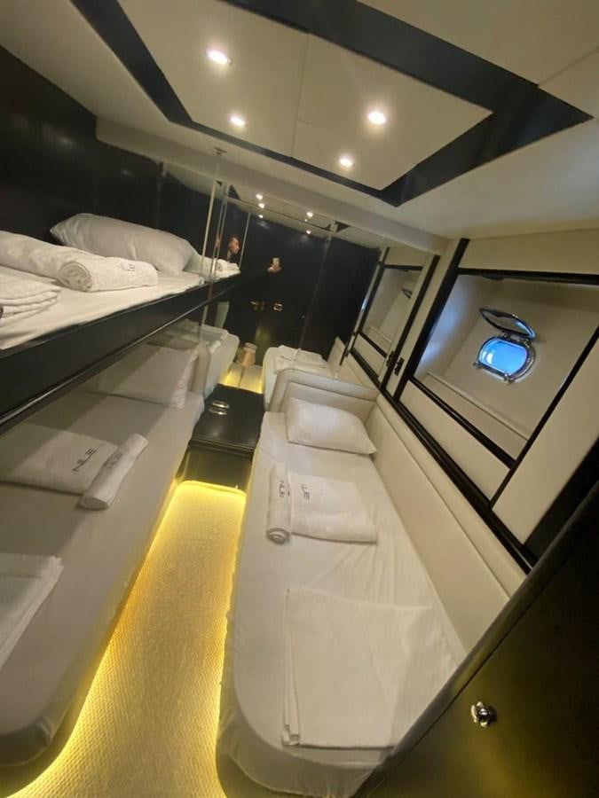 a room with a bed and a mirror aboard NILE Yacht for Sale