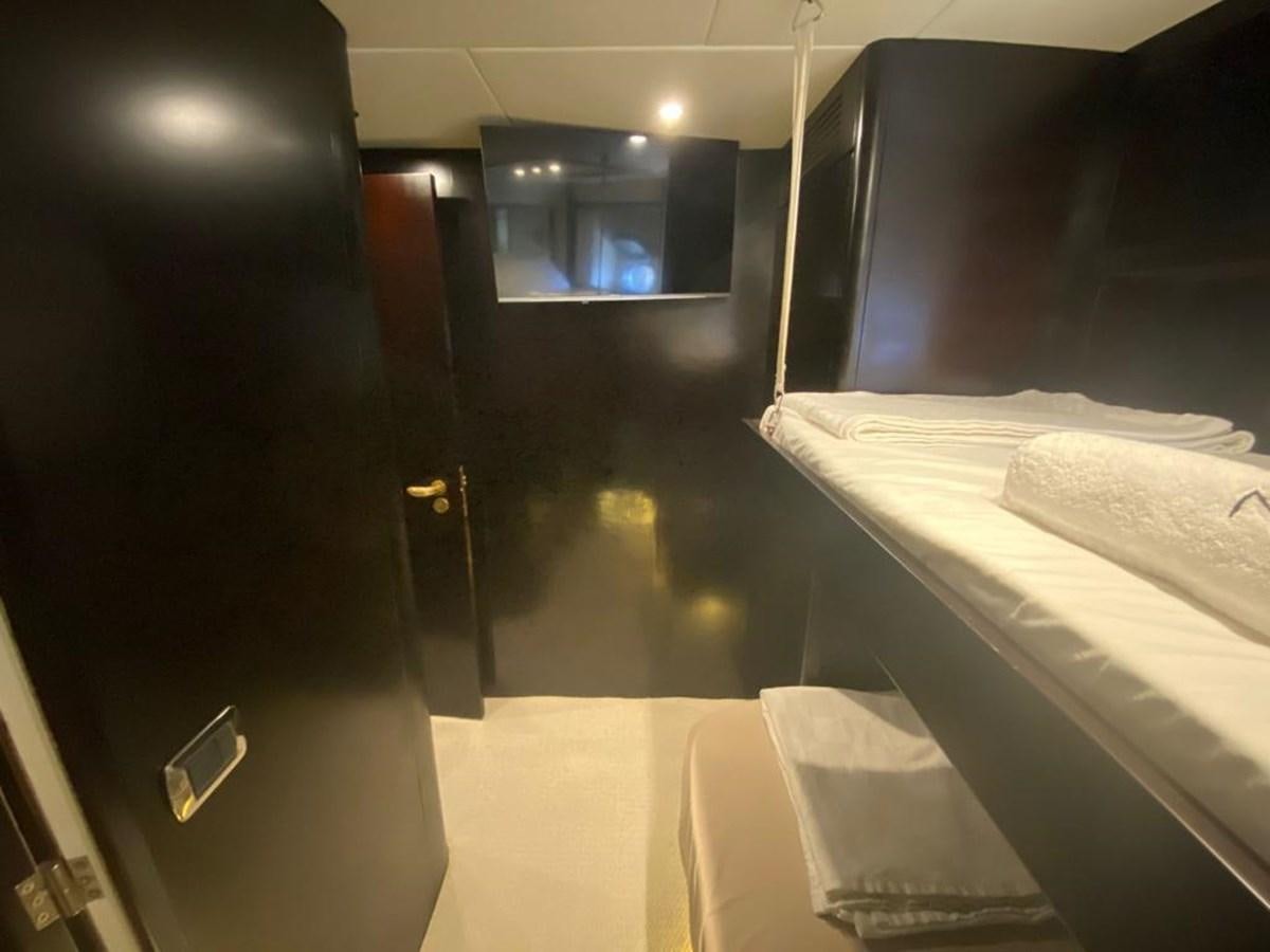 a room with a bed and a mirror aboard NILE Yacht for Sale