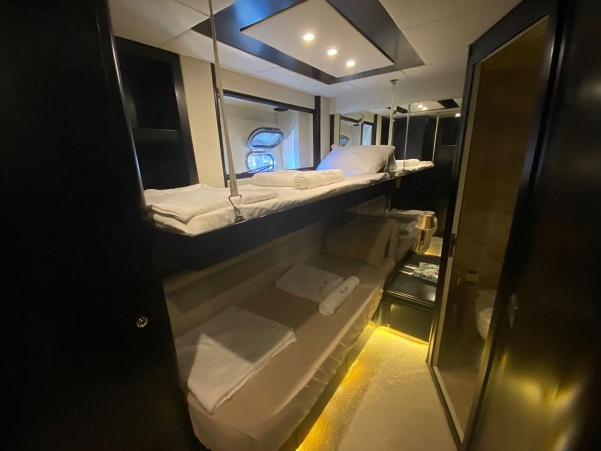 a room with a bed and a mirror aboard NILE Yacht for Sale