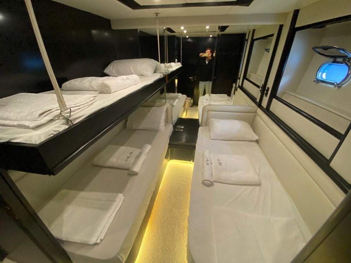 a room with a bed and a couch aboard NILE Yacht for Sale