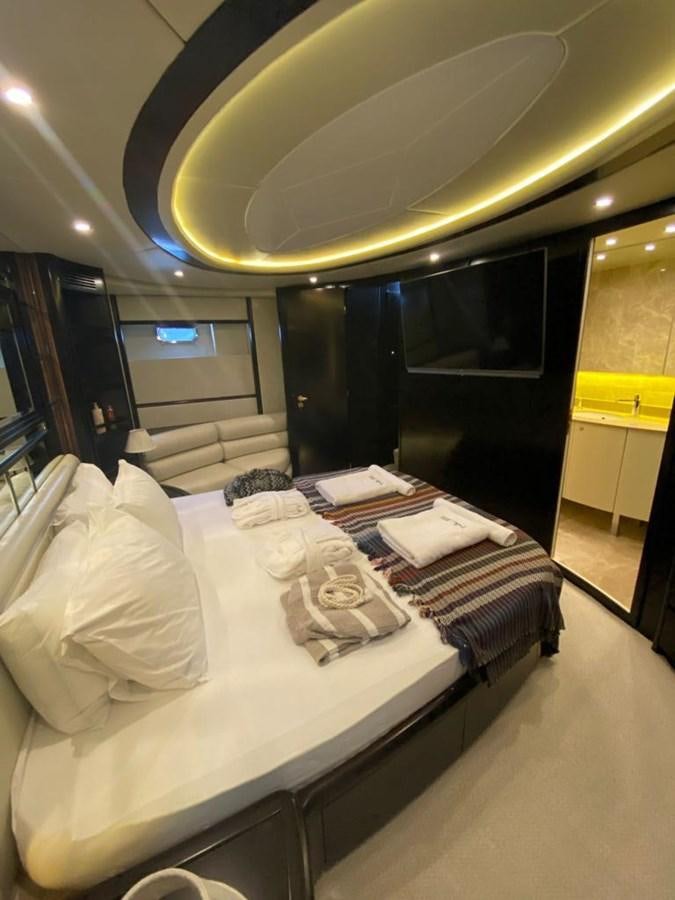 a bed with white sheets aboard NILE Yacht for Sale