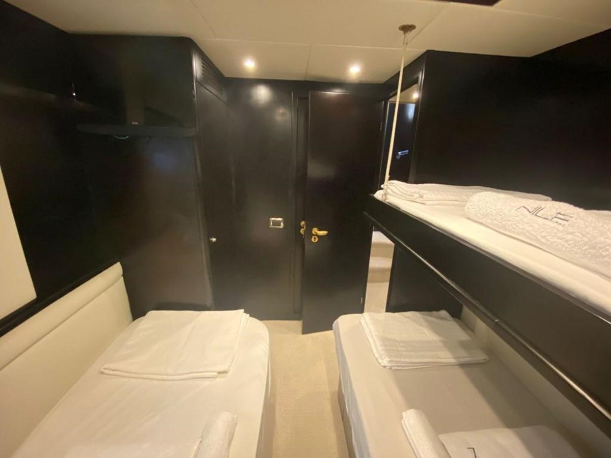 a room with a bed and a desk aboard NILE Yacht for Sale