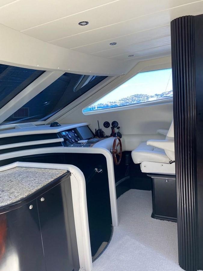 a room with a bed and desk aboard NILE Yacht for Sale
