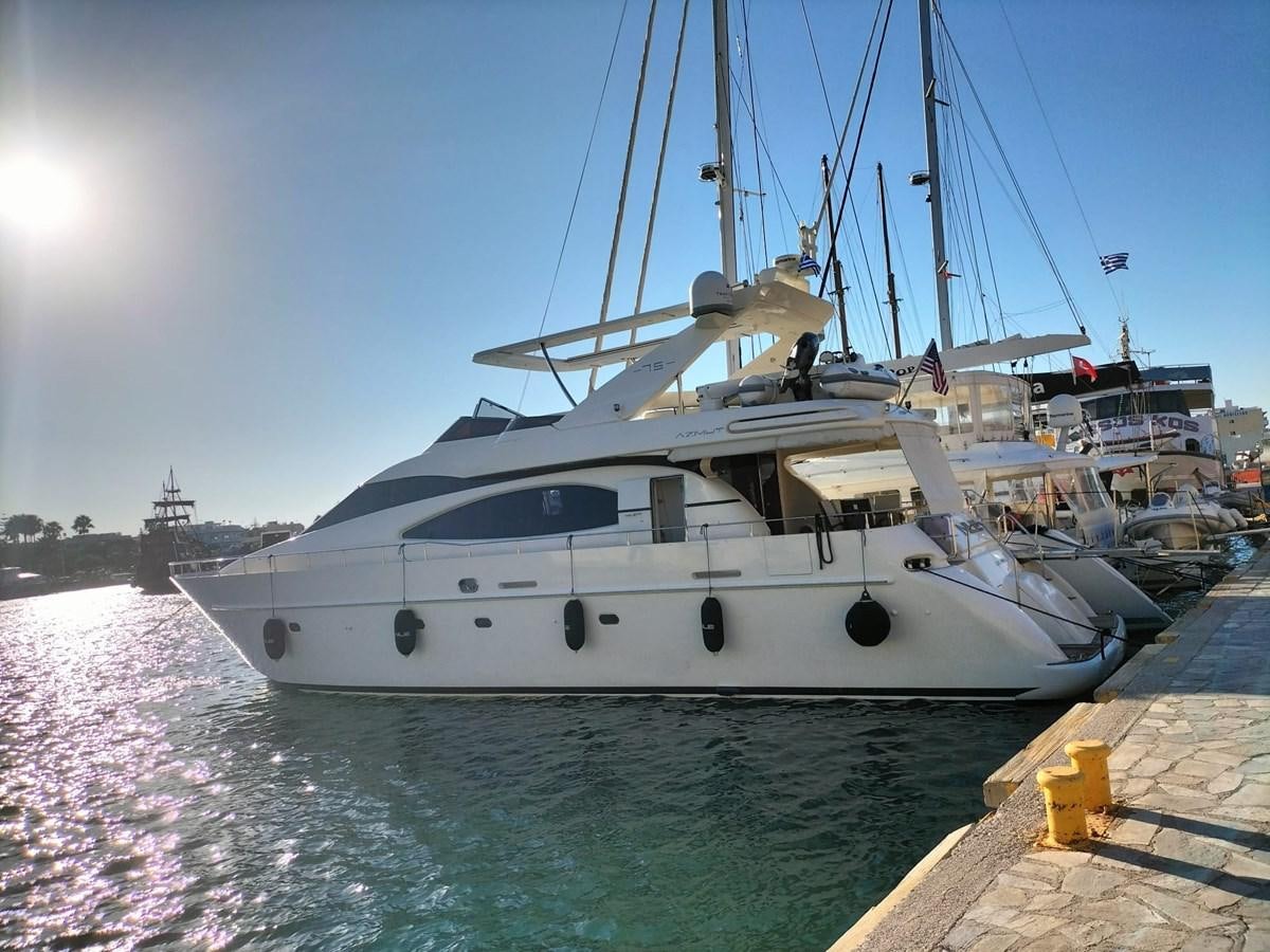 a large white boat docked at a dock aboard NILE Yacht for Sale