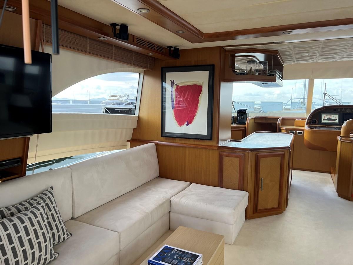 a living room with a couch and a tv aboard B Yacht for Sale
