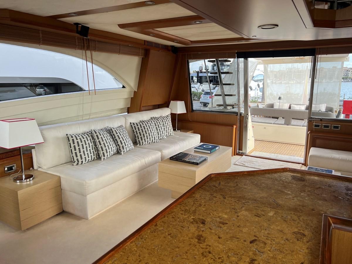a living room with a large window aboard B Yacht for Sale